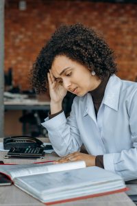 stressed accountant a person frowning while reading a book